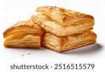 Golden, flaky layers of puff pastry, isolated on a white background, showcasing its light and airy texture.