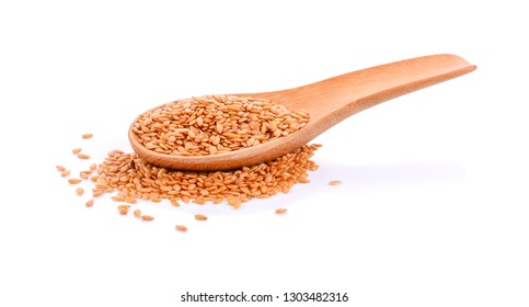 Golden Flaxseed In A Wooden Spoon On White Background.