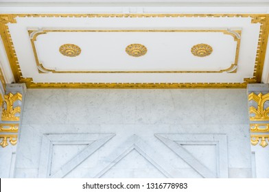 Golden Flower Sculpture On The Ceiling On The Marbel Wall Of The Thai Temple.