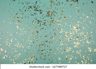 Golden flying sparkles on blue holiday background. Festive backdrop for your projects. - Shutterstock ID 1677489727