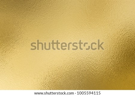 Golden foil decorative texture. Gold shiny background