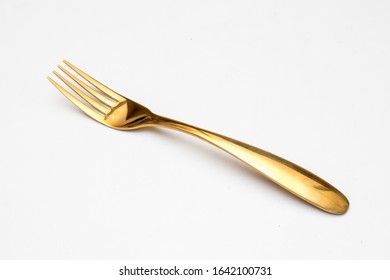 A Golden fork on isolated white background