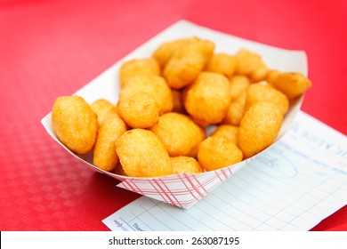 Golden fried cheese curds. Shallow focus.