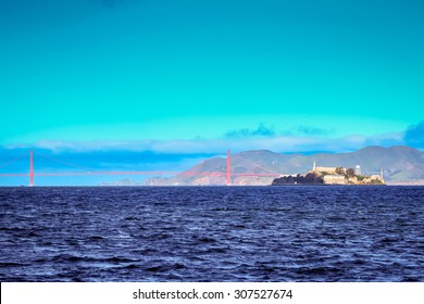 The Golden Gate Bridge And Alcatraz Island In The San Francisco Bay At Sunrise.
