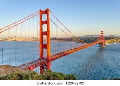 The Golden Gate Bridge, with Down Town San Francisco, and de San Francisco Bay Area as a background, during the sunset golden hour. Image taken from from Battery Vista in Marin County, California. - Shutterstock ID 1120472702