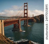 The Golden Gate Bridge is an iconic suspension bridge spanning the Golden Gate strait, connecting San Francisco to Marin County. Renowned for its striking orange color .