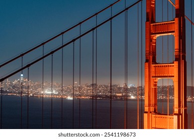 Golden Gate Bridge nighttime glowing San Francisco skyline Bridge - Powered by Shutterstock