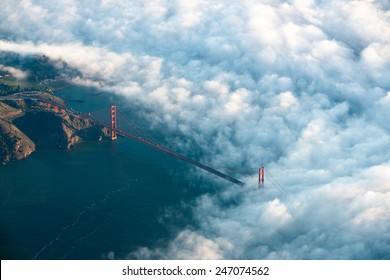 The Golden Gate Bridge Rises Through Dramatic Early Morning Fog Seen From Above