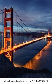 Golden Gate Bridge And San Francisco Lights At Sunset