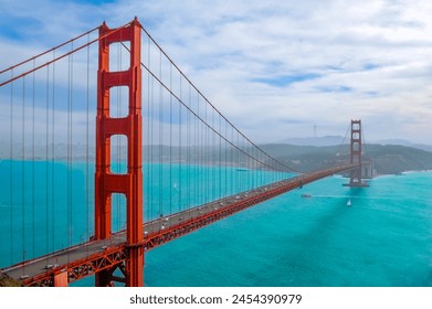 Golden Gate Bridge in San Francisco California. San Francisco skyline view through the suspension cables of Golden Gate Bridge on a foggy day. Downtown view bay cloud car. Red Golden Gate - Powered by Shutterstock