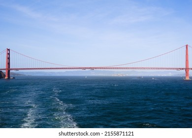 Golden Gate Bridge as seen from the ocean side, with Alcatraz and San Francisco visible in the background