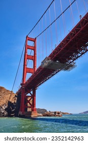 Golden Gate Bridge underside and side from choppy San Francisco Bay waters