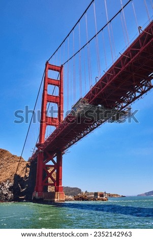Golden Gate Bridge underside and side from choppy San Francisco Bay waters