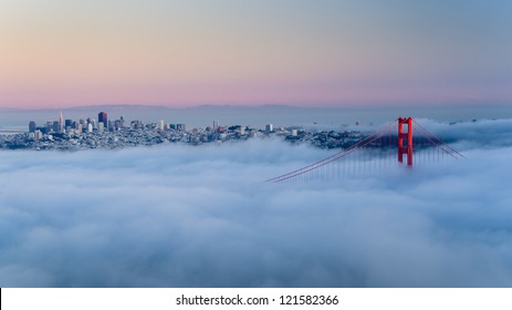 Golden Gate At Dawn Surrounded By Fog