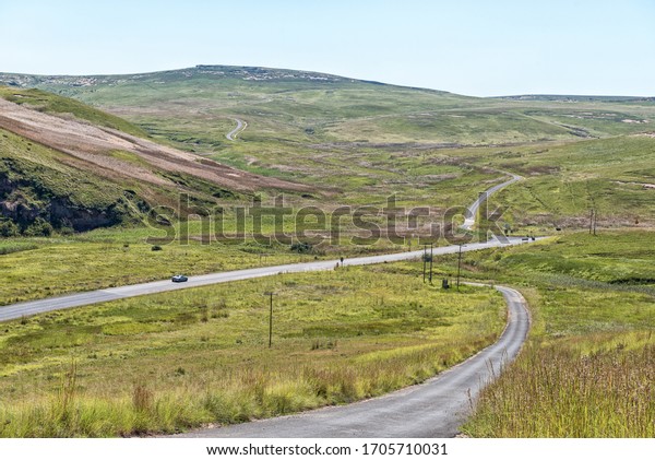 GOLDEN GATE\
HIGHLANDS NATIONAL PARK, SOUTH AFRICA - MARCH 5, 2020: The Golden\
Gate landscape as seen from the Blesbok Loop. The Oribi loop, road\
R712 and a vehicle are\
visible