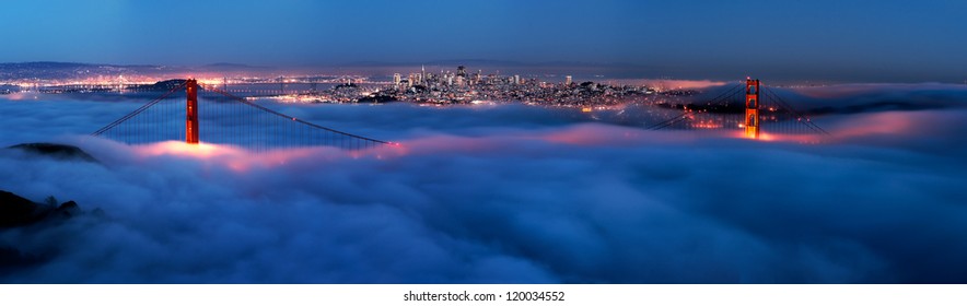 Golden Gate At Night Surrounded By Fog