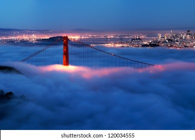 Golden Gate At Night Surrounded By Fog