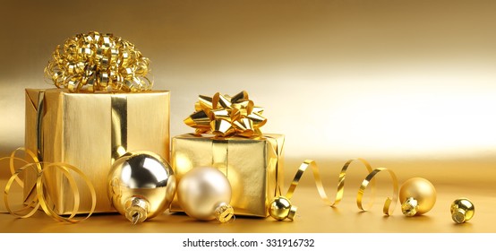 Golden gift boxes with decoration on abstract background - Powered by Shutterstock