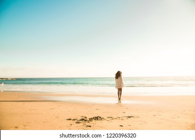 Golden girl on the beach - Powered by Shutterstock