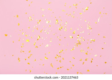 Golden glitter confetti sparkles on pastel pink background. Flat lay, top view. Holiday, festive, party backdrop. - Shutterstock ID 2021137463