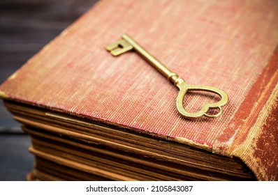 Golden Heart Shape Key On An Old Book, Love Story, Valentines Day, Self Love Concept