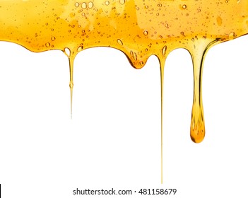golden honeycombs and wooden drizzler with honey isolated on white
