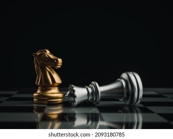 The golden horses, knight chess piece standing near the loser silver queen chess piece who fell on chessboard background. Leadership, winner, loser, competition, and business strategy concept.