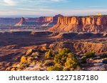 Golden Hour Light on Candlestick Tower and the Island in the Sky from the end of Grand Viewpoint in Canyonlands National Park, Utah.