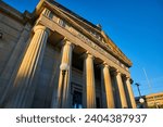 Golden Hour at Muncie Public Library with Classic Columns and Sculptures
