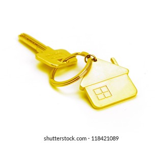 golden house key isolated on white - Powered by Shutterstock