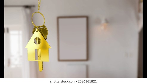 Golden house-shaped keychain hanging in focus, with blurry background. Empty frame on wall enhancing room minimalistic charm, creating a serene atmosphere - Powered by Shutterstock