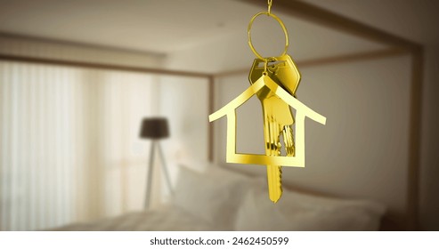 Golden house-shaped keychain with keys hanging in bedroom. Sunlight filters through sheer curtains, creating a warm atmosphere - Powered by Shutterstock