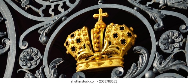 Golden imperial crown on the front gate of the Winter Palace. Saint Petersburg, Russia. History, symbol, national landmark, sightseeing theme