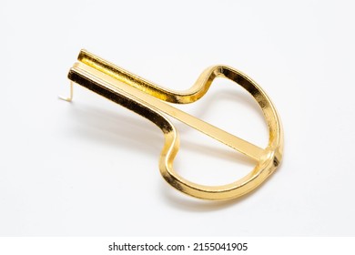 Golden Jaw Harp On White Background