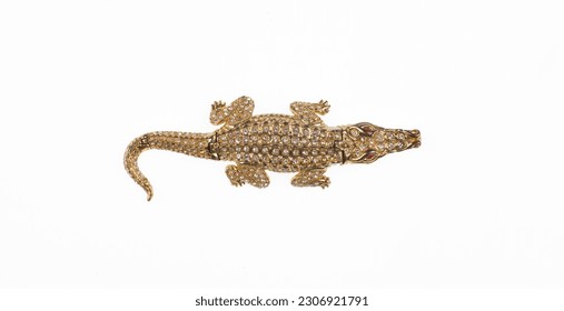 golden jewelry crocodile isolated on white background