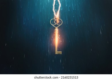 Golden key with glowing lights and dark background, wisdom, wealth, and spiritual concept - Shutterstock ID 2160231513