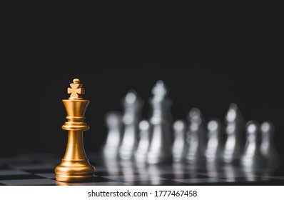 Golden King Chess Stand Alone Among  Silver Chess Enemy At Opposite Side. Strategy Decision For Marketing Business With Competitors Company Concept.