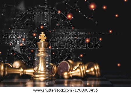 Golden king chess stand alone with fallen silver chess pieces. Winner of business competition and marketing strategy planing concept.