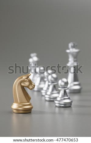 Golden King with silver king, bishop, pawn on the background