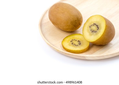 Golden Kiwi Fruit On Wooden Plate