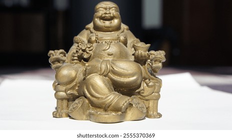 Golden Laughing Buddha Statue Figurine Sitting on Throne - Powered by Shutterstock