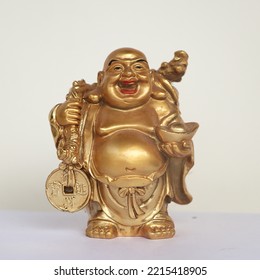 Golden Laughing Buddha Statue Isolated In A White Background