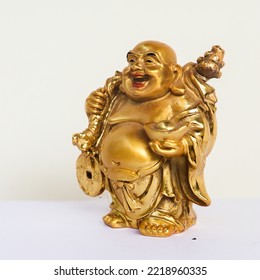 golden laughing buddha statue isolated in a white background - Powered by Shutterstock