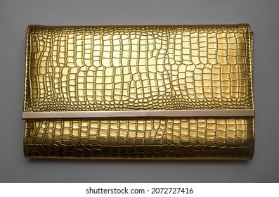 Golden Leather Clutch Isolated On White Background. Yellow  Lacquer Bag 