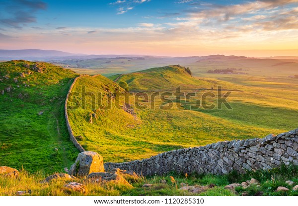Golden Light at\
Hadrian\'s Wall Caw Gap,  a World Heritage Site in the beautiful\
Northumberland National Park. Popular with walkers along the\
Hadrian\'s Wall Path and Pennine\
Way