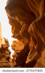 Golden light rays inside Antelope Canyon slot canyon, warm sandstone walls, Arizona
