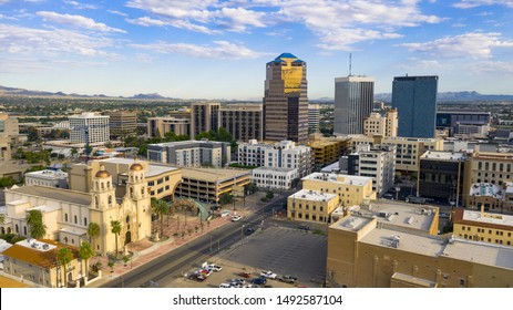 Golden light reflects off the buildings in the downtown city center of Tucson Arizona 