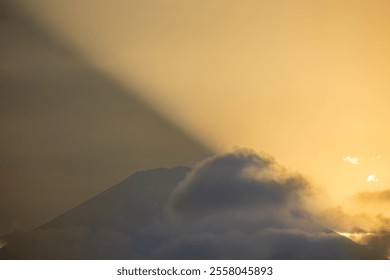 Golden Light and Shadow Over Mount Fuji at Sunset - Powered by Shutterstock