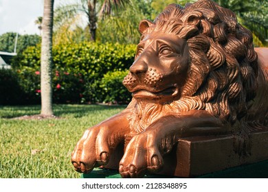 Golden Lion Statue In A Tropical Setting