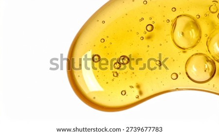 Golden liquid texture with bubbles on white background for beauty or medical product advertising